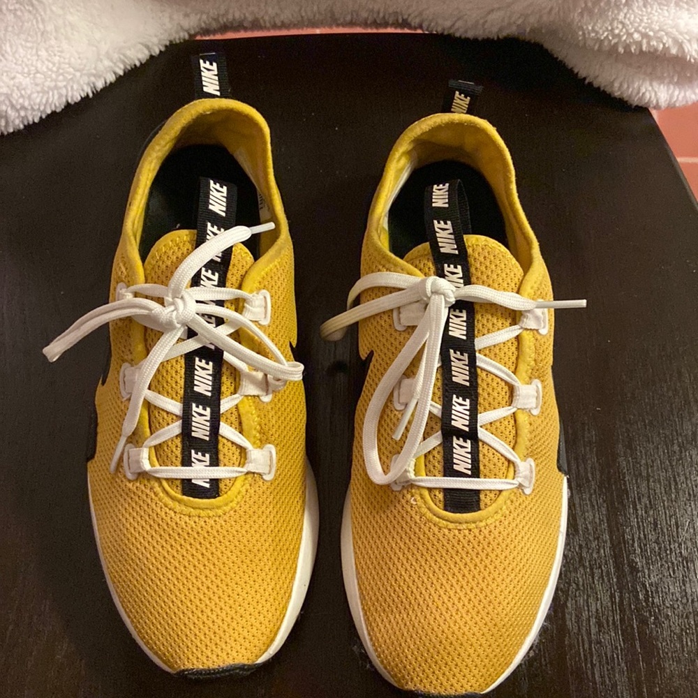 Yellow, black and white Nike for women.